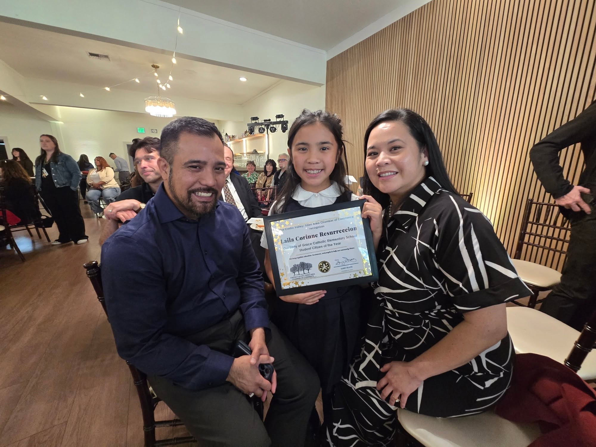A Lion family celebrating their daughter being named Student Citizen of the Year