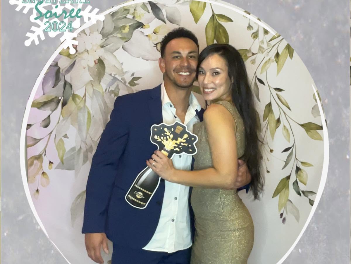 An OLG couple celebrating at the Snowflake Soiree